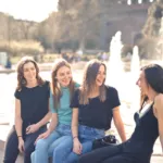 Group of friends laughing together, showing social connection and emotional well-being