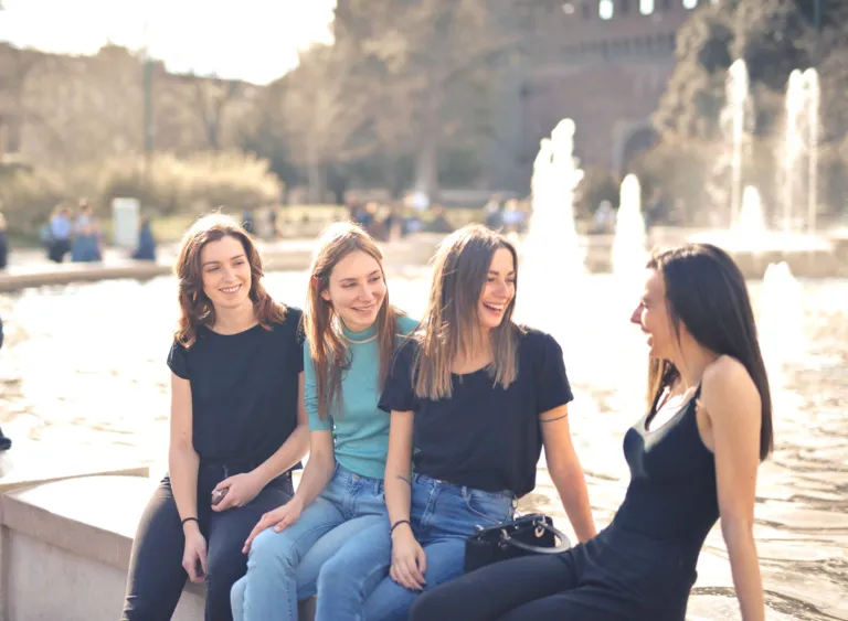 Group of friends laughing together, showing social connection and emotional well-being